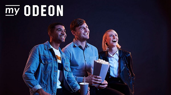 Three people holding popcorn and smiling with words 'my odeon' in text