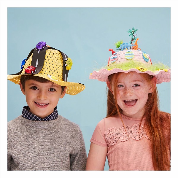 two children wearing easter bonnets