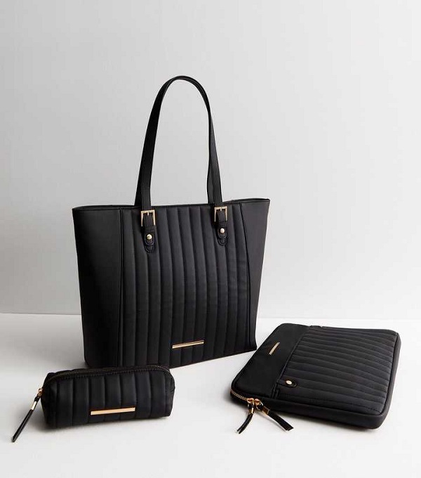 A black quilted tote bag and accessories