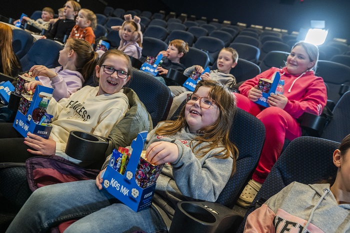 kids watching a film in the cinema